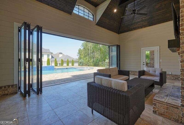 view of patio with outdoor lounge area and ceiling fan