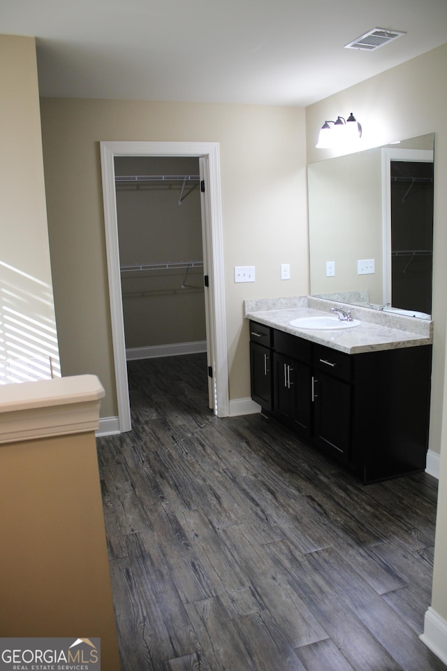 bathroom featuring vanity and hardwood / wood-style flooring