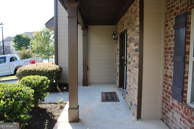 doorway to property with a porch