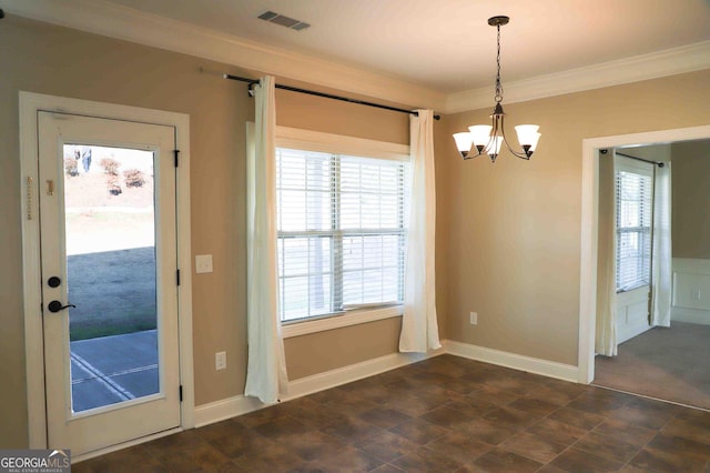 unfurnished dining area featuring an inviting chandelier and ornamental molding