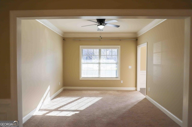 spare room with ceiling fan, light carpet, and ornamental molding