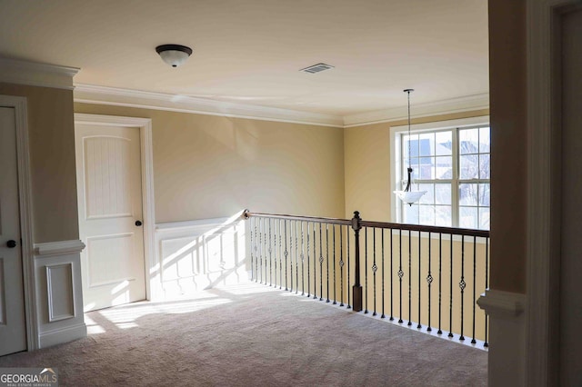 corridor featuring carpet floors and crown molding