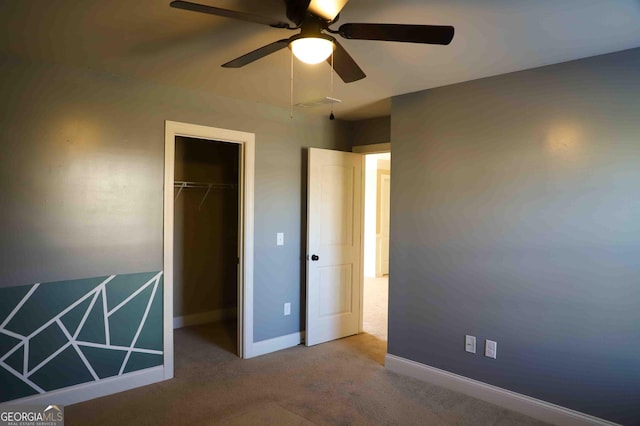 unfurnished bedroom with carpet floors, a closet, and ceiling fan