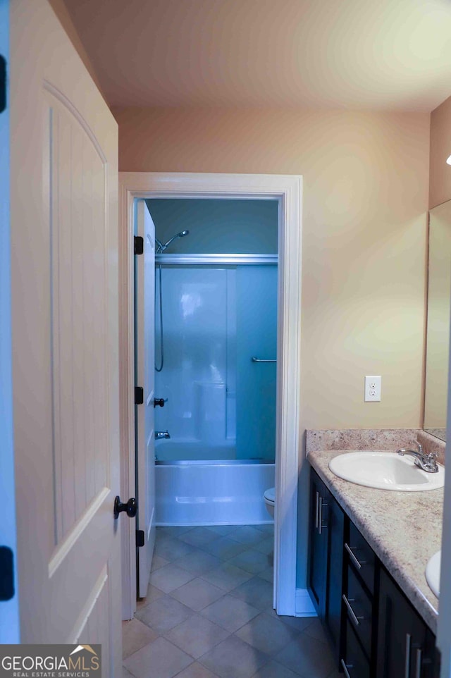 full bathroom featuring bathtub / shower combination, vanity, and toilet