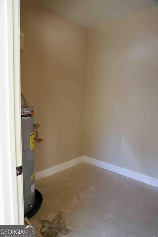 utility room featuring water heater