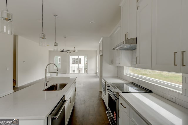 2029 Memorial Dr Unit 34, Atlanta, GA 30317 - kitchen with appliances with stainless steel finishes, a sink, under cabinet range hood, and backsplash