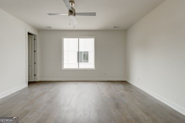 2029 Memorial Dr Unit 34, Atlanta, GA 30317 - empty room with wood finished floors, baseboards, and ceiling fan