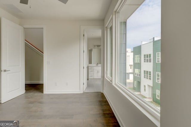 2029 Memorial Dr Unit 34, Atlanta, GA 30317 - unfurnished bedroom with wood finished floors, baseboards, ensuite bathroom, and a spacious closet