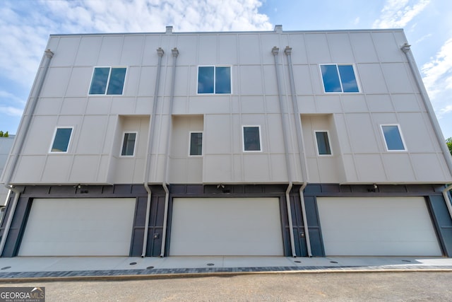 2029 Memorial Dr Unit 34, Atlanta, GA 30317 - view of building exterior with a garage