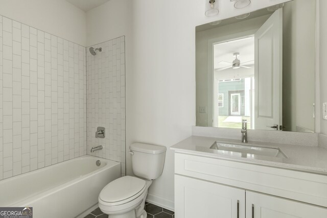 2029 Memorial Dr Unit 34, Atlanta, GA 30317 - bathroom featuring toilet, vanity, bathing tub / shower combination, a ceiling fan, and tile patterned floors
