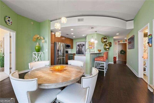 dining room featuring dark hardwood / wood-style flooring