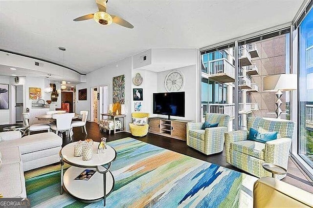 living room featuring dark wood-type flooring, a wall of windows, and ceiling fan