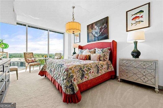 bedroom with floor to ceiling windows and light colored carpet