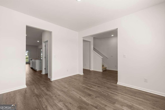 empty room with dark hardwood / wood-style floors