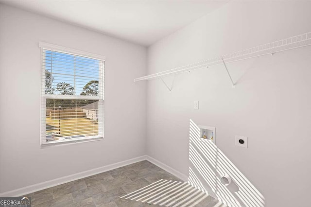 washroom with hookup for a washing machine and hookup for an electric dryer