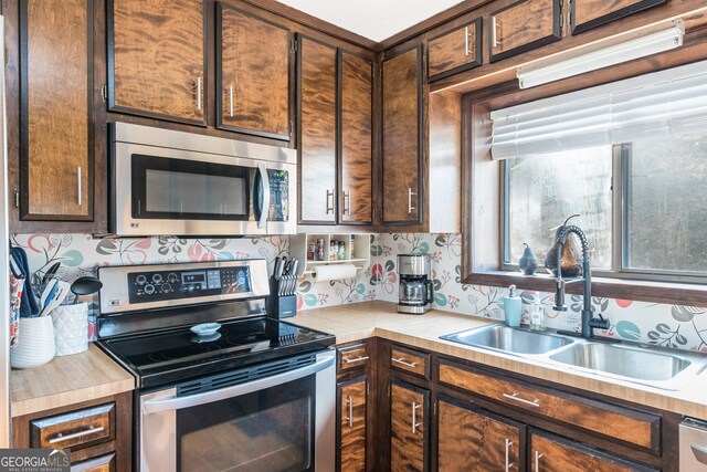 kitchen featuring stainless steel appliances and sink