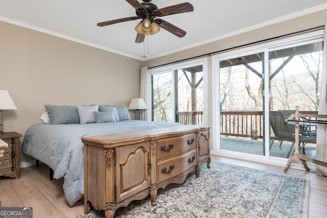 bedroom with light wood-type flooring, ceiling fan, access to exterior, and crown molding