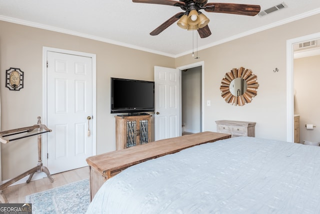 bedroom featuring ensuite bath, ceiling fan, crown molding, and light hardwood / wood-style flooring