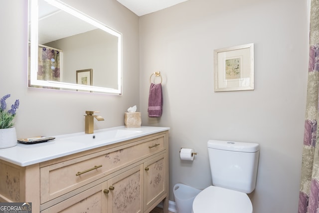 bathroom with vanity and toilet