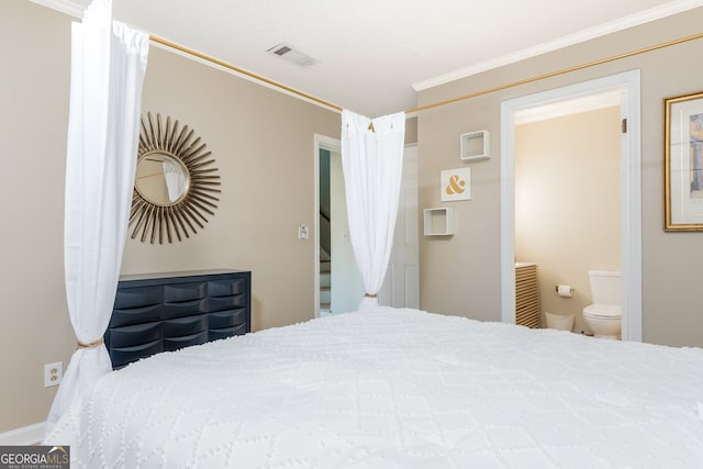 bedroom with connected bathroom and ornamental molding