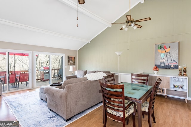 interior space with high vaulted ceiling, ceiling fan, wood-type flooring, and beam ceiling