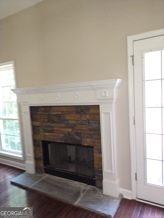 interior details featuring hardwood / wood-style floors and a fireplace