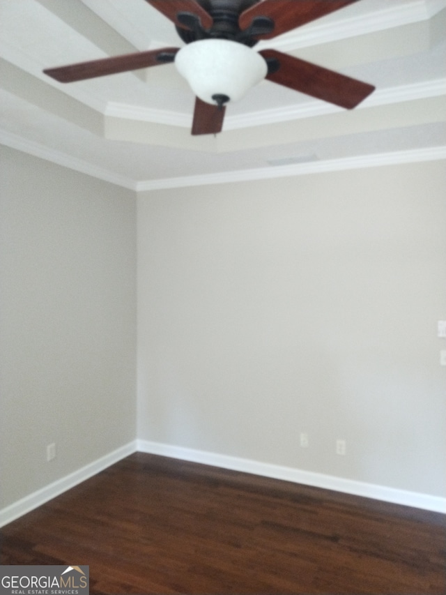 spare room with crown molding, ceiling fan, and hardwood / wood-style floors