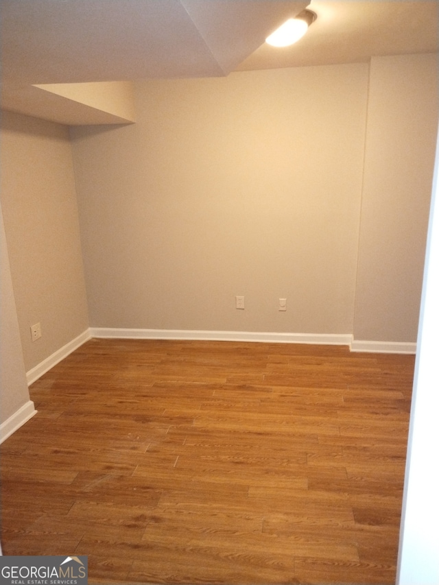 spare room with light hardwood / wood-style flooring