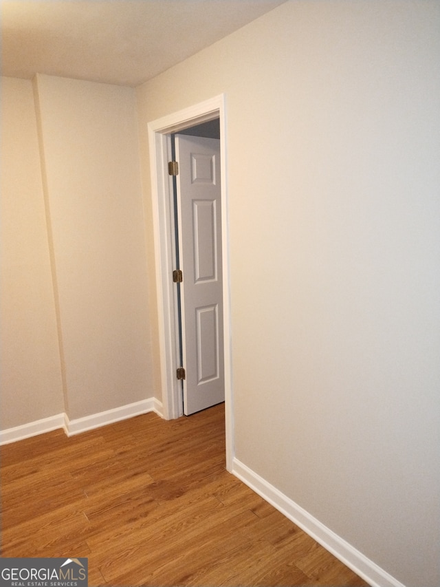 unfurnished room featuring light wood-type flooring