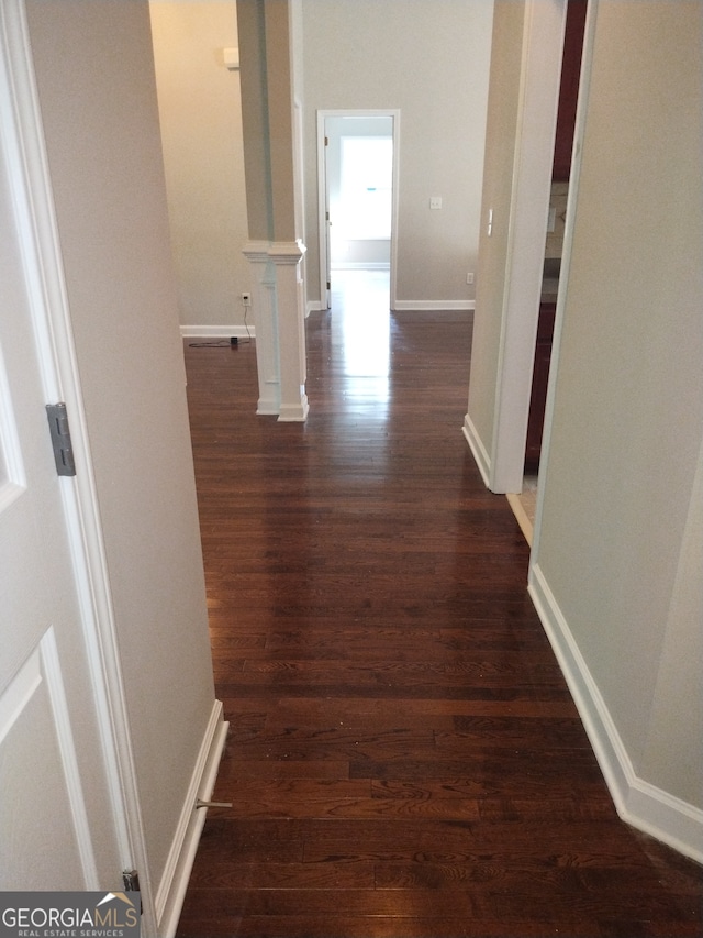 hall featuring dark wood-type flooring