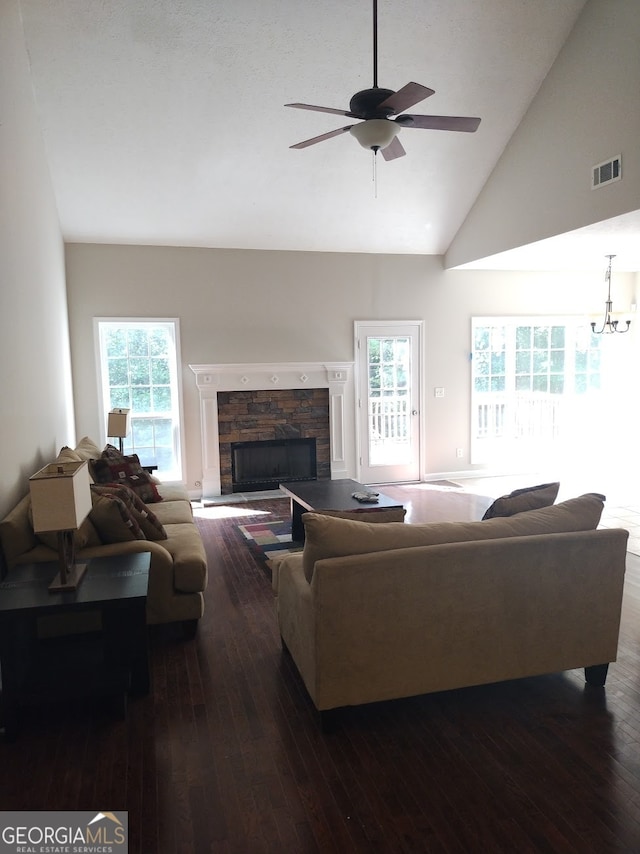 living room featuring a fireplace, high vaulted ceiling, ceiling fan, and dark hardwood / wood-style floors