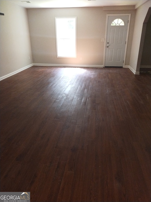 foyer with dark hardwood / wood-style floors