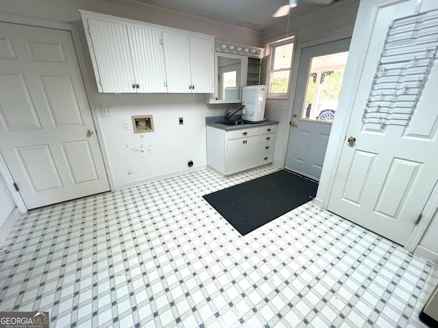 washroom featuring cabinets, ornamental molding, sink, and hookup for an electric dryer