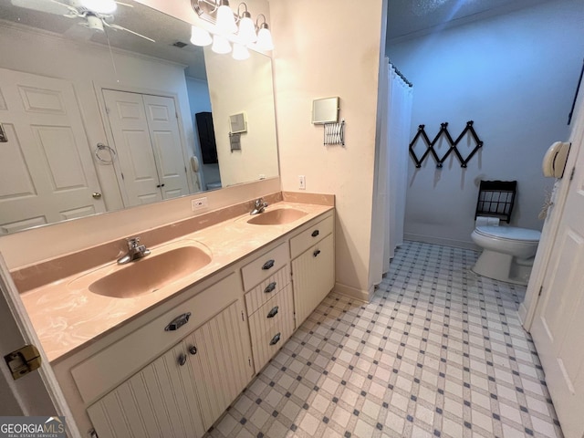 bathroom with curtained shower, vanity, toilet, ornamental molding, and a chandelier