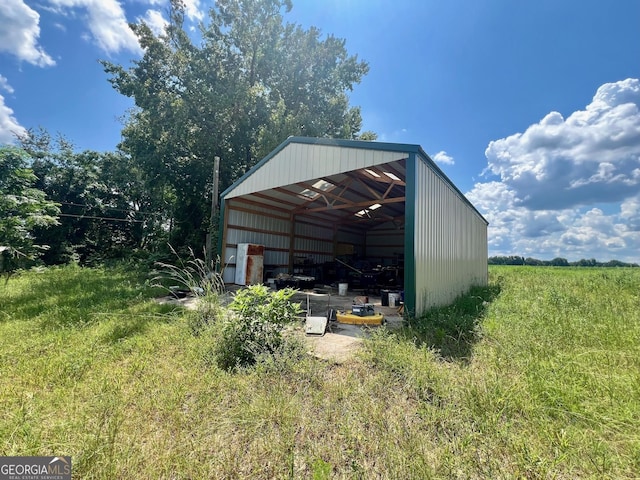 view of outbuilding with a rural view