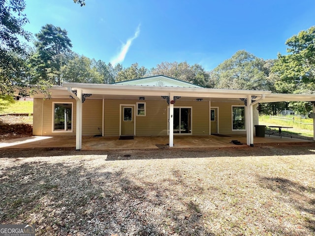 rear view of property with a patio area