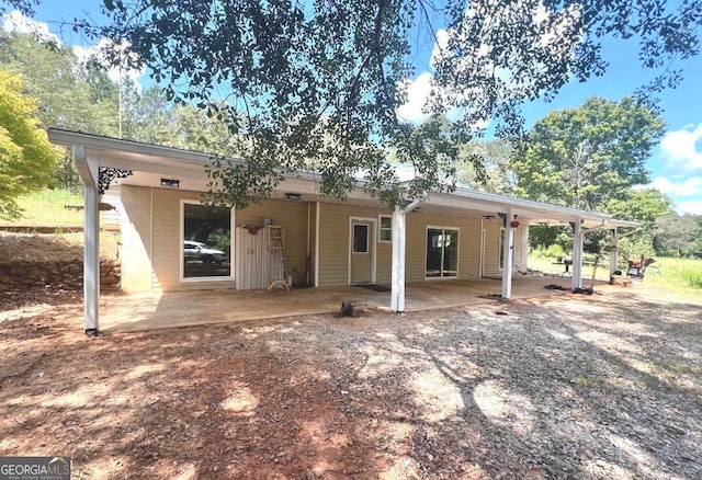 back of house with a patio