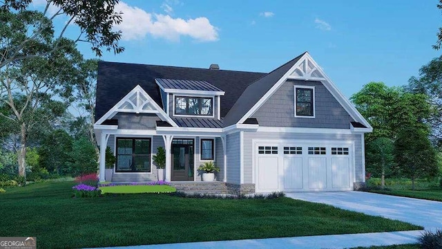 view of front of home with a garage and a front lawn