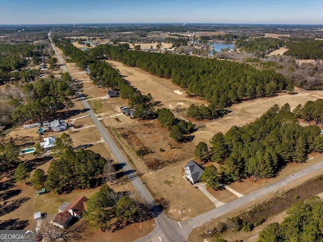 aerial view featuring a water view and a rural view