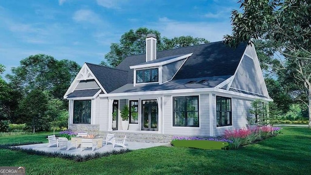 rear view of property featuring a lawn and a patio