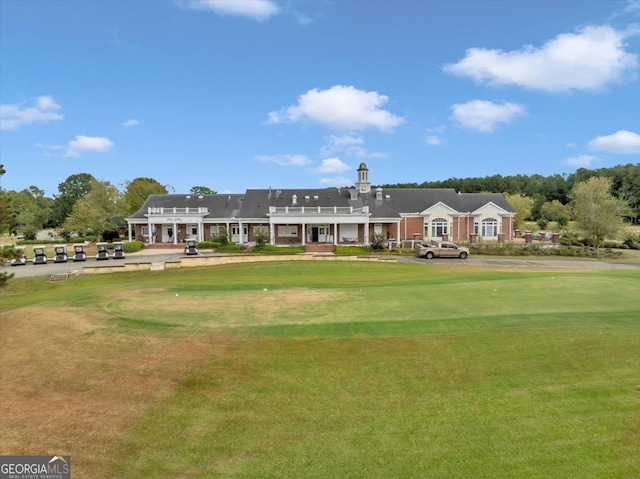 view of home's community featuring a lawn