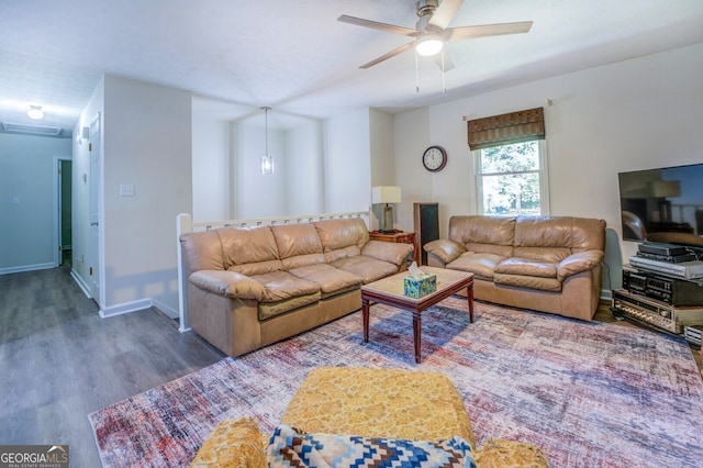 living room featuring ceiling fan and hardwood / wood-style floors