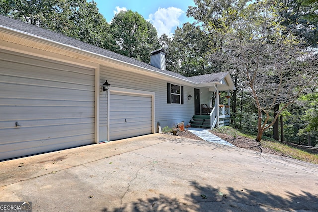 ranch-style house featuring a garage