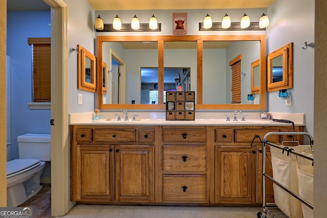 bathroom with vanity and toilet