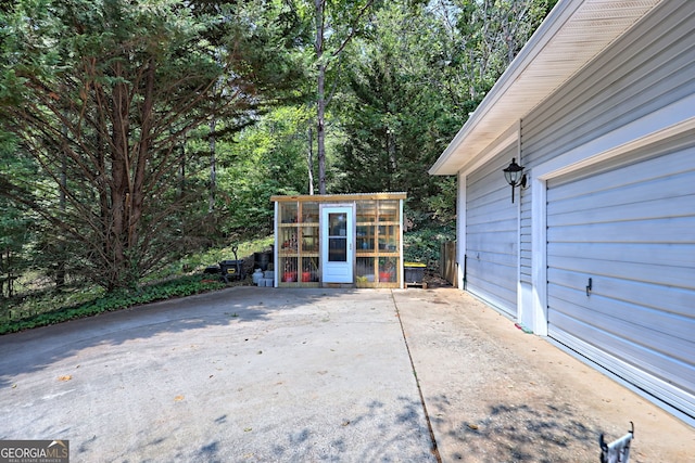 view of patio featuring an outdoor structure