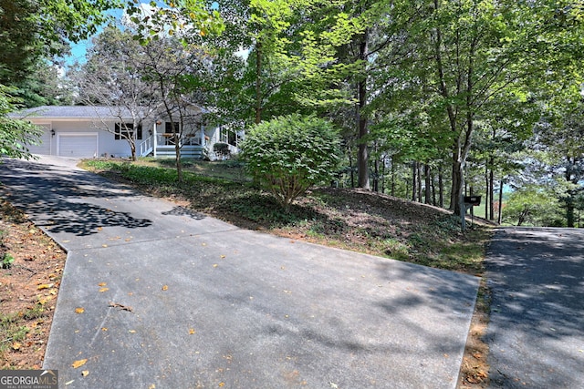 view of front of property with a garage and a porch