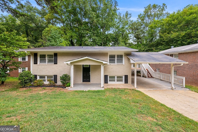 split foyer home featuring a front yard and a patio