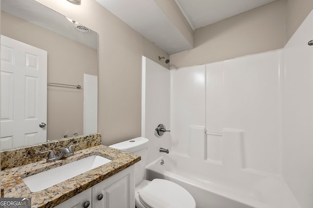 full bathroom with washtub / shower combination, toilet, and vanity