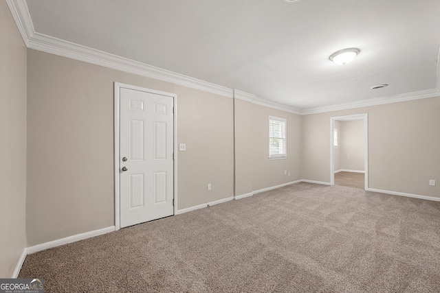 carpeted spare room with ornamental molding