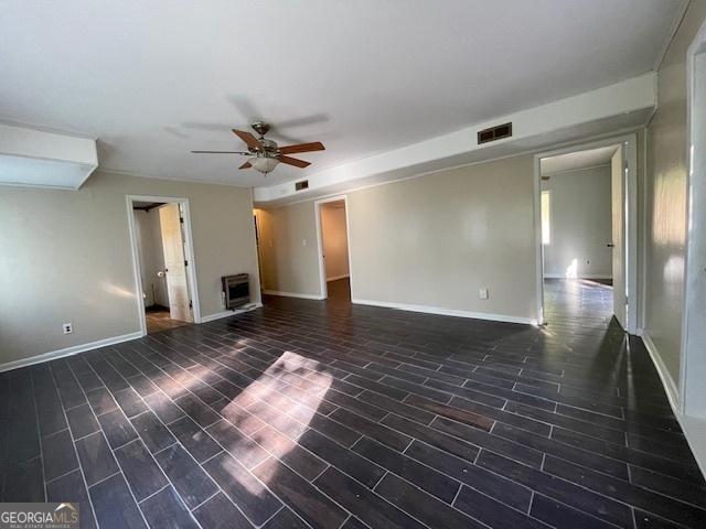 interior space featuring ceiling fan and dark hardwood / wood-style floors